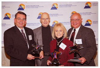 2008 Ronald H. Levine Legacy Award Recipients (left to right: John Frank of the Kate B. Reynolds Charitable Trust; former State Health Director Dr. Ron Levine; Mary Piepenbring of The Duke Endowment; and Thomas Bridges, Henderson County health director)