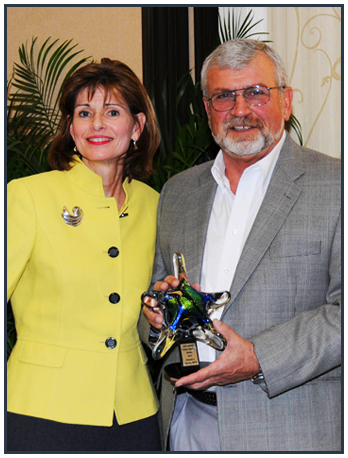 Don Yousey (right) received the Levine Award for Local Innovation in Public Health from Dr. Devlin