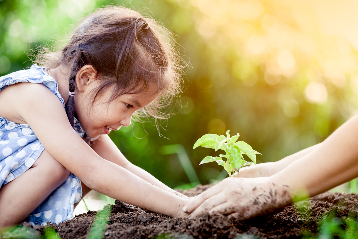 Girl and woman planting